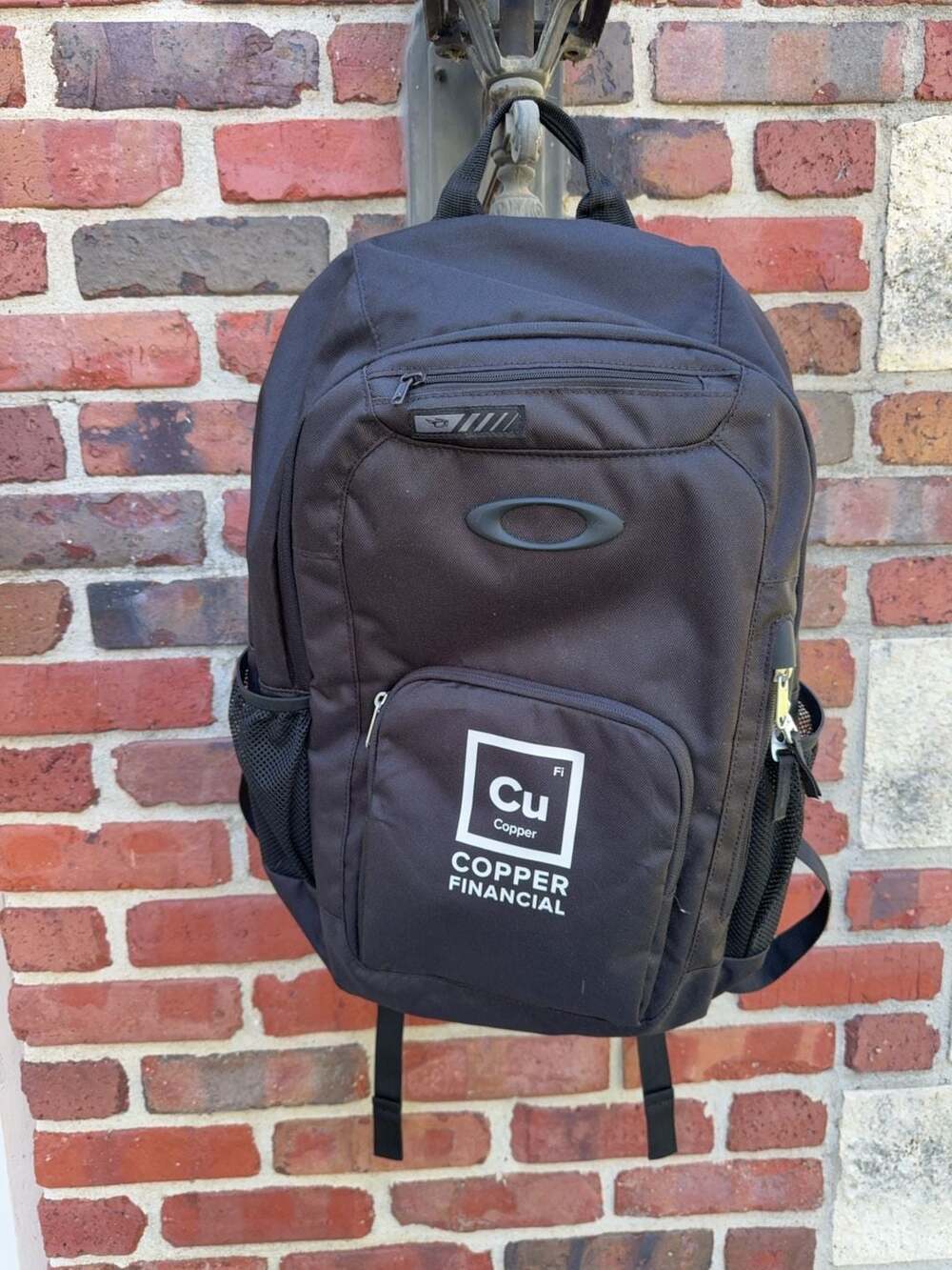 Oakley Branded Copper Financial Logo Backpack
